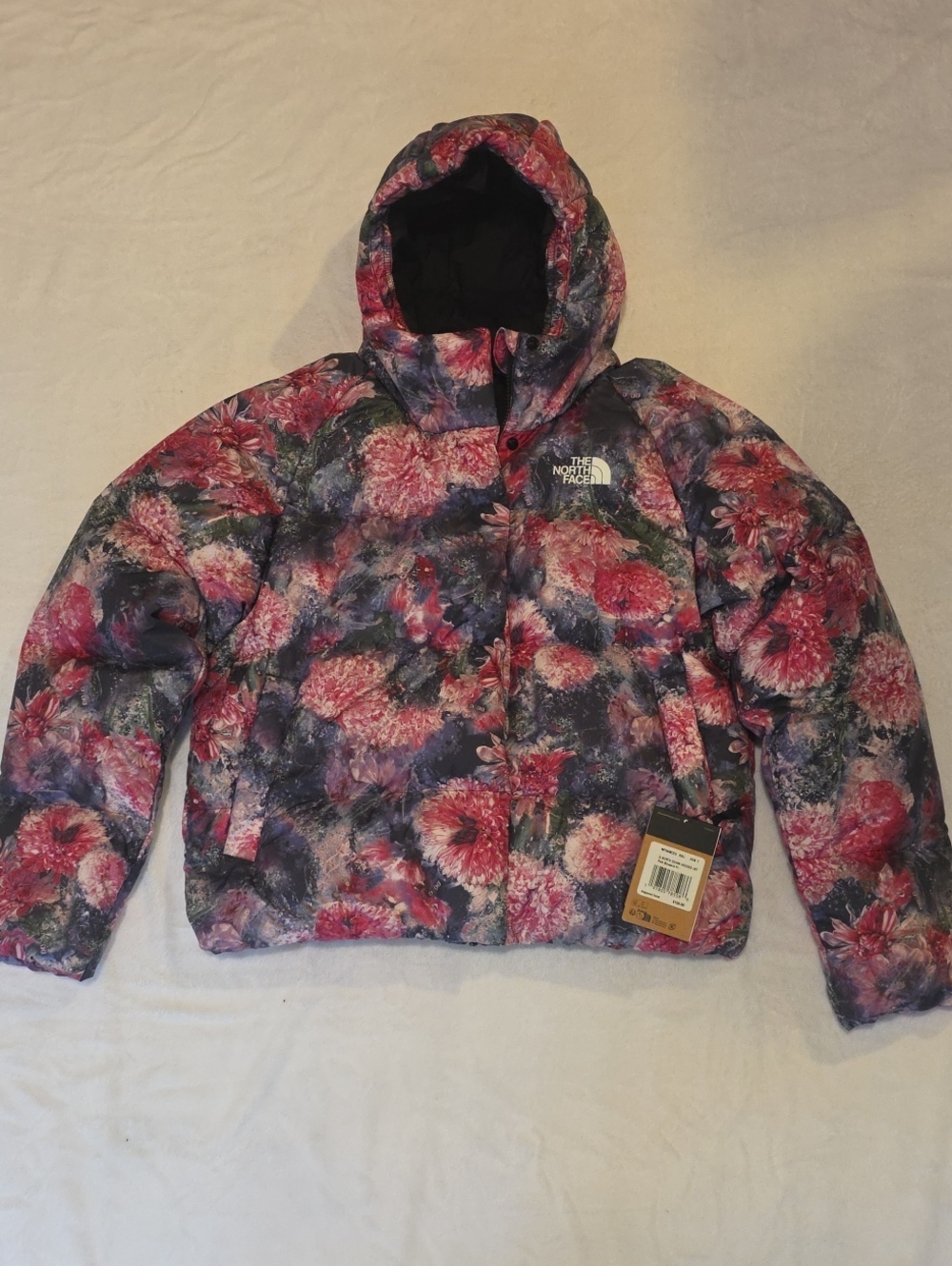 The North Face Kids Floral Hooded Puffer Jacket in Pink and Purple